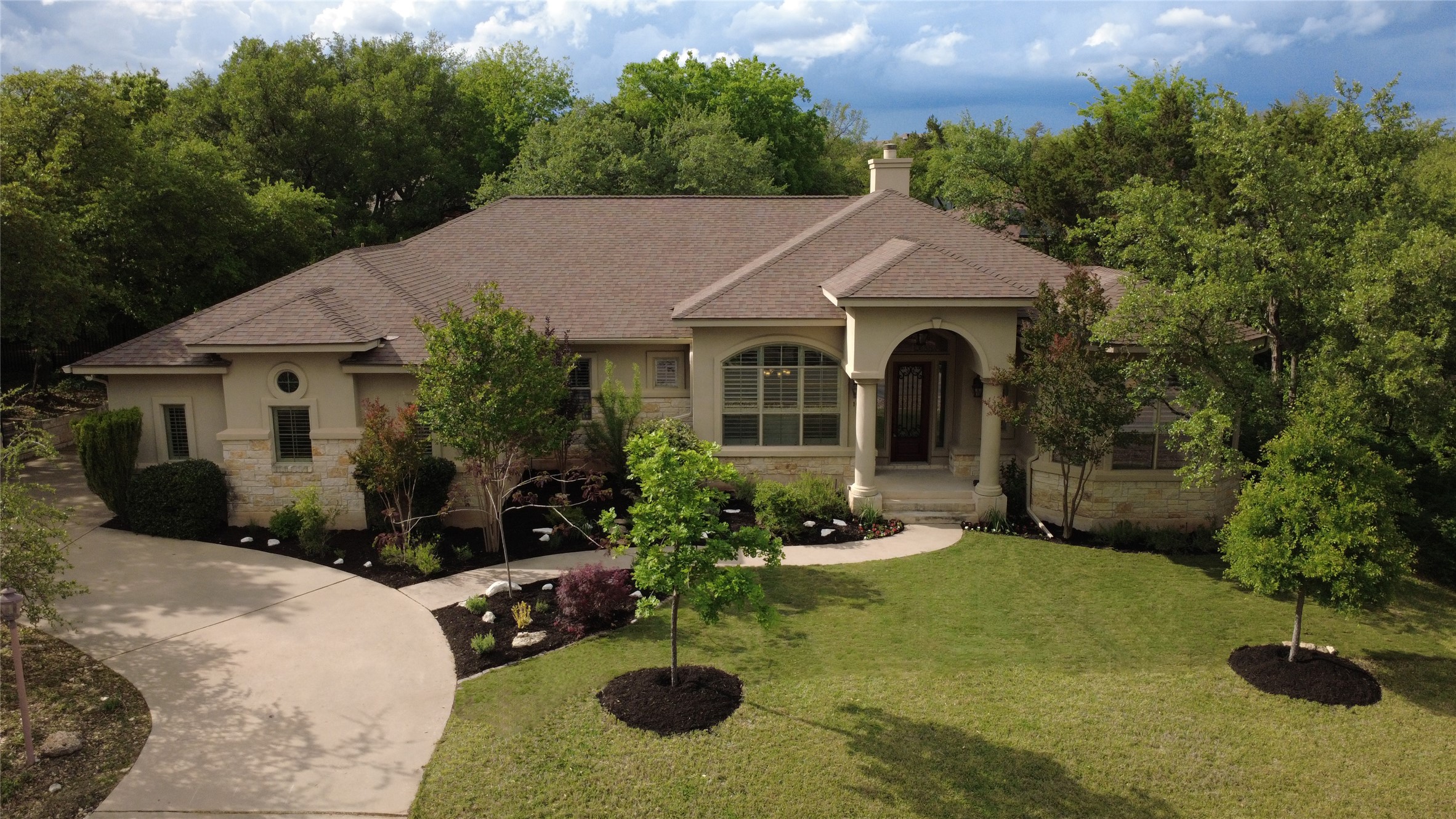 1012 Sailmaster Street Lakeway, TX 78734 - Photo 26 of 26 a front view of a house with porch yard and outdoor seating