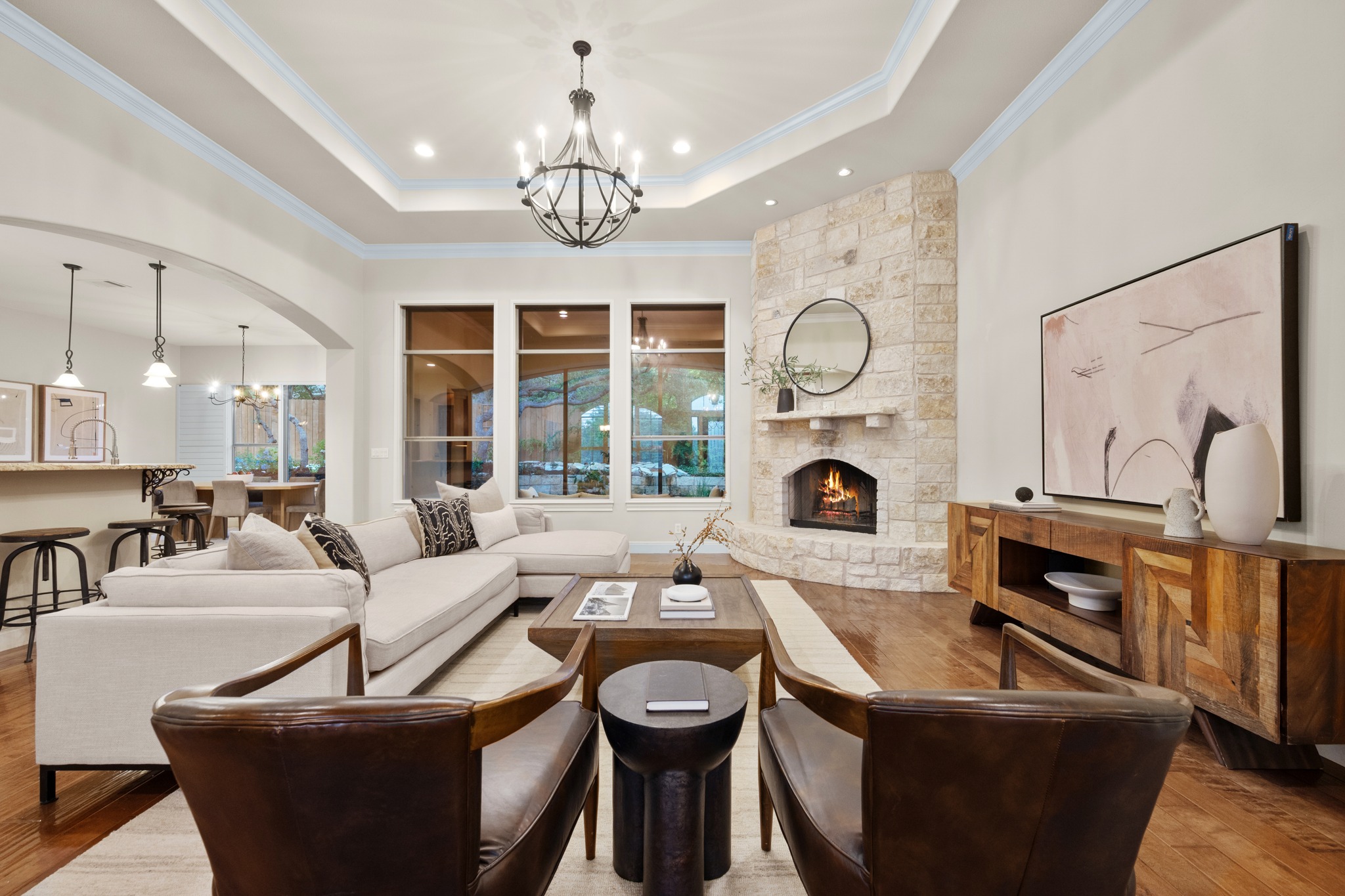 1012 Sailmaster Street Lakeway, TX 78734 - Photo 5 of 26 a living room with fireplace furniture and a large window