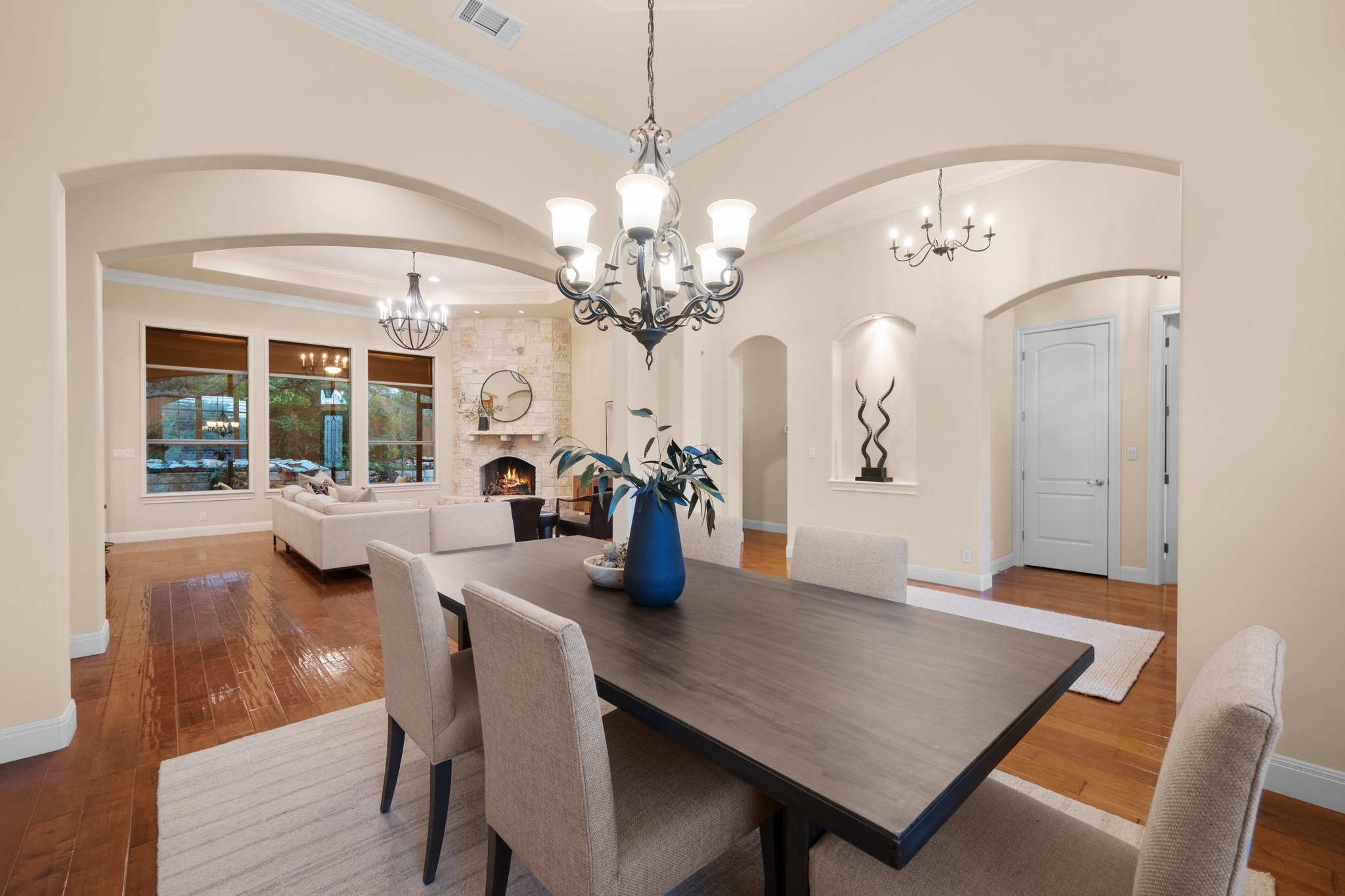 1012 Sailmaster Street Lakeway, TX 78734 - Photo 7 of 26 a view of a dining room with furniture and chandelier