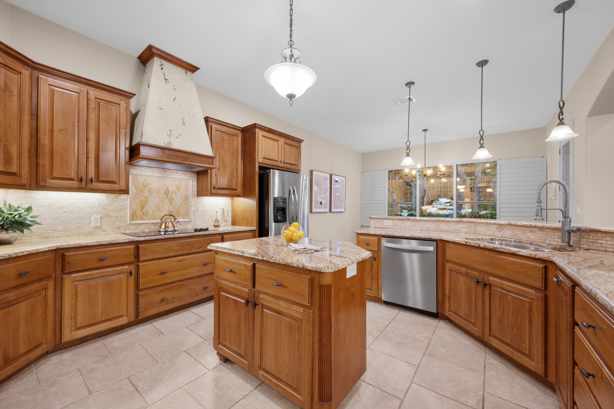 1012 Sailmaster Street Lakeway, TX 78734 - Photo 9 of 26 a kitchen with sink and cabinets