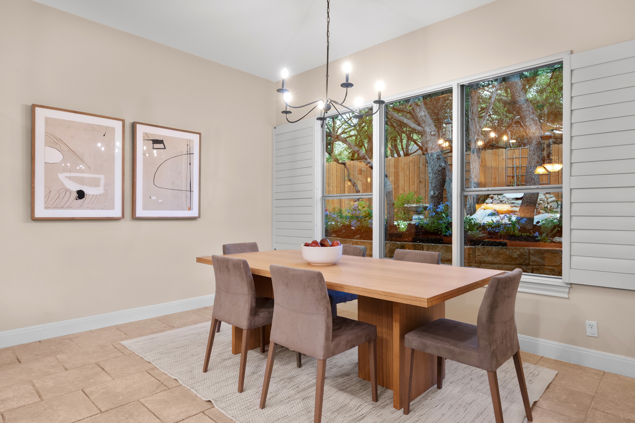 1012 Sailmaster Street Lakeway, TX 78734 - Photo 10 of 26 a view of a dining room with furniture large windows and wooden floor