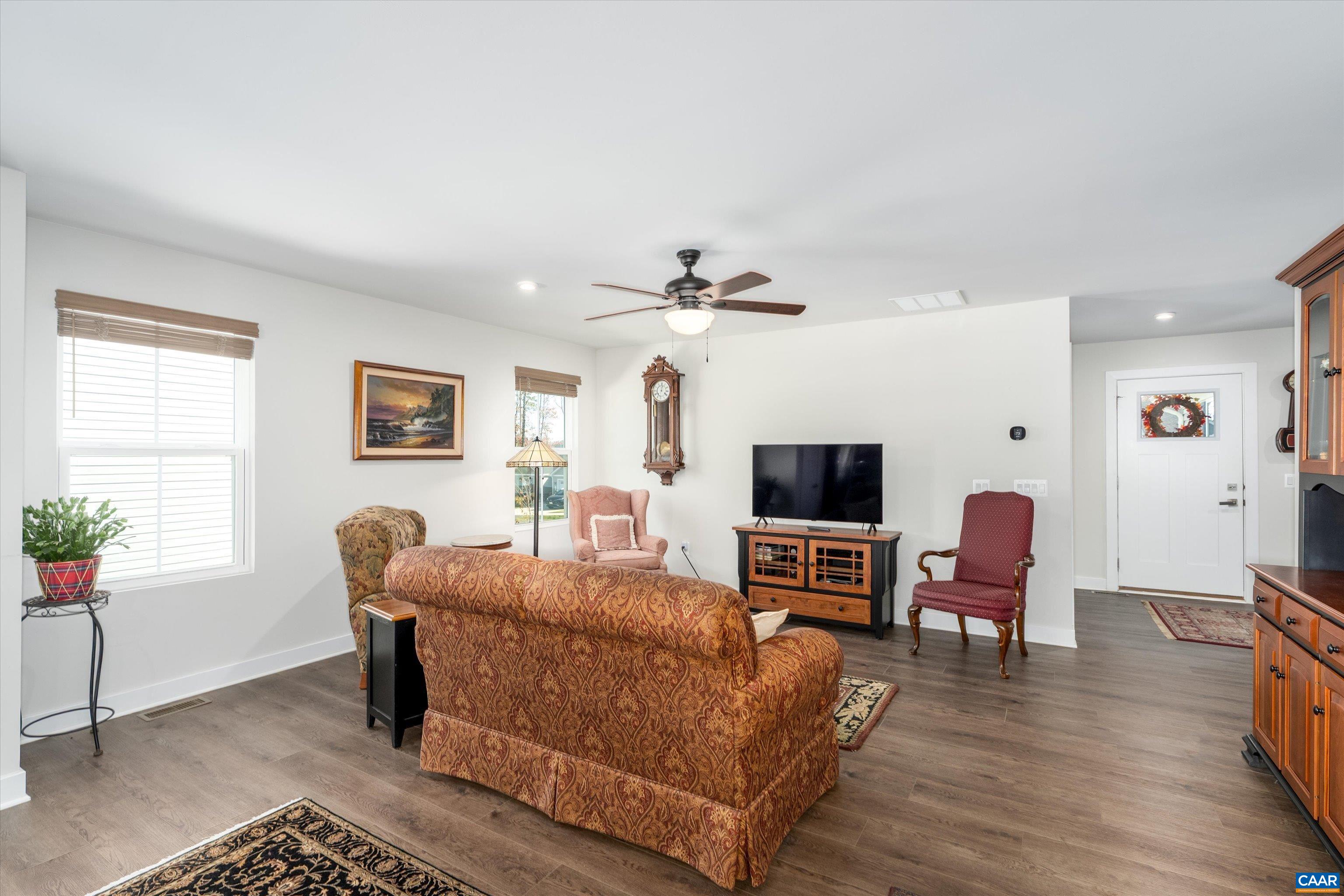 93 Archer Drive Palmyra, VA 22963 - Photo 12 of 45 a living room with furniture a flat screen tv and a window