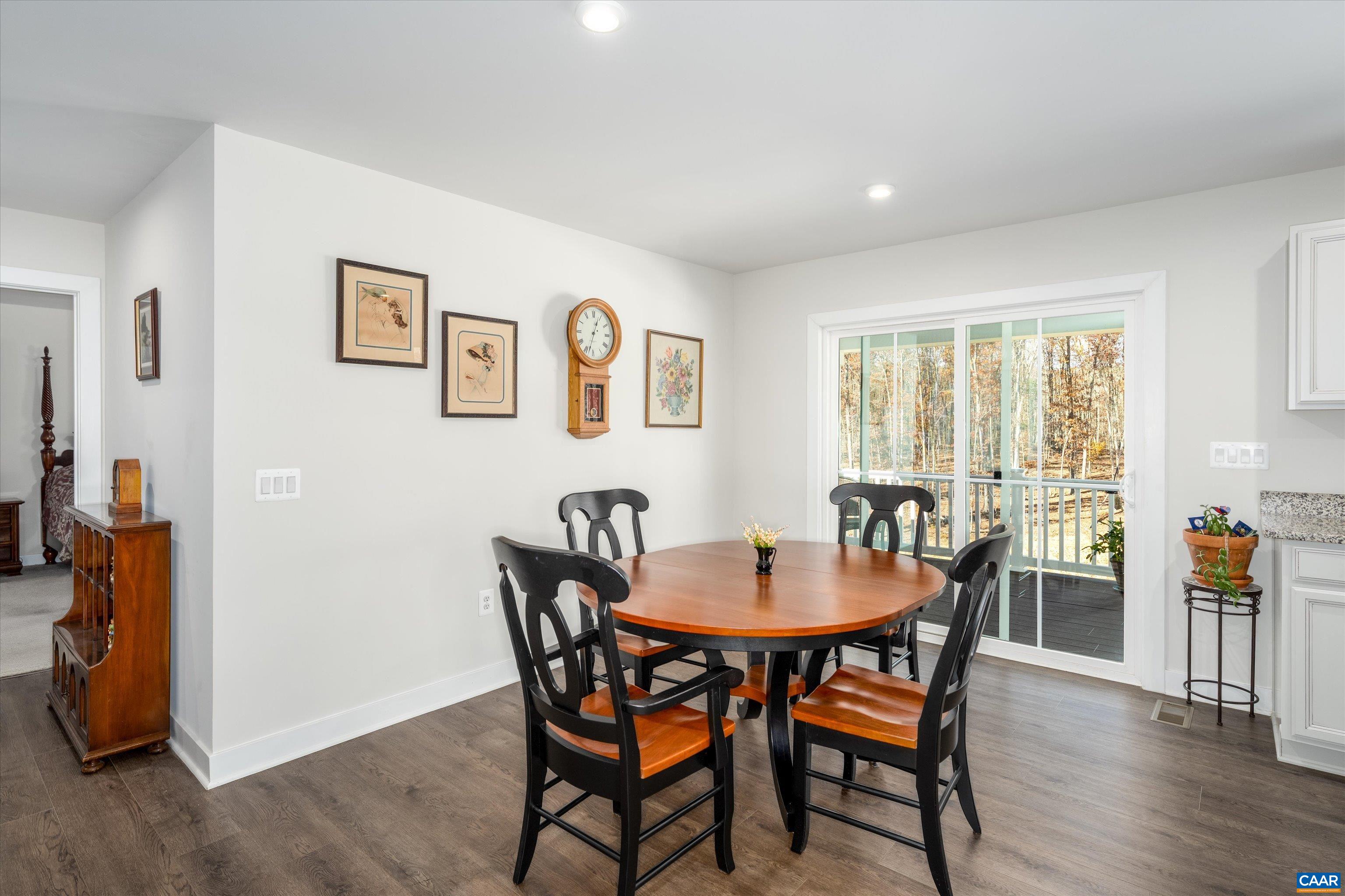 93 Archer Drive Palmyra, VA 22963 - Photo 15 of 45 a view of a dining room with furniture and wooden floor