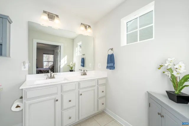a bathroom with a sink a vanity and a mirror