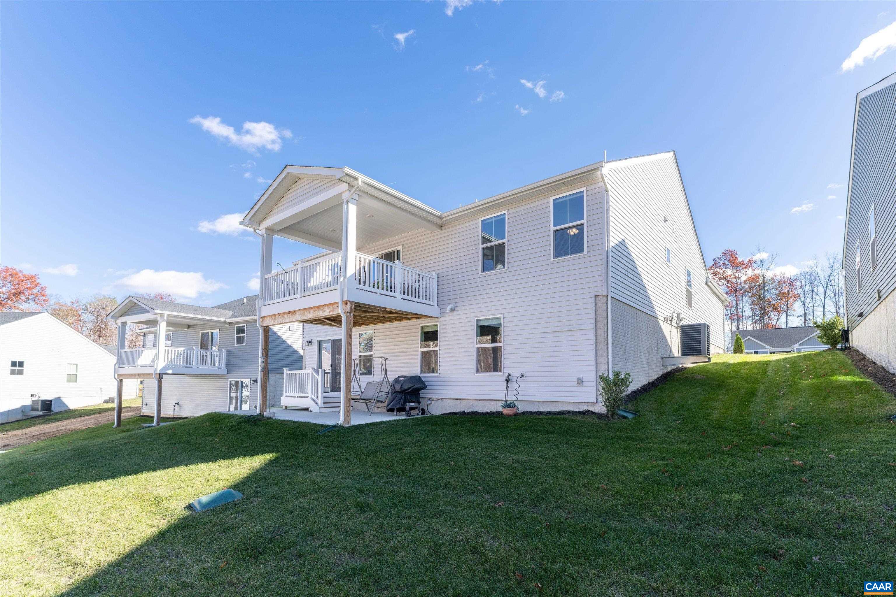 93 Archer Drive Palmyra, VA 22963 - Photo 3 of 45 a view of a house with a big yard and large trees