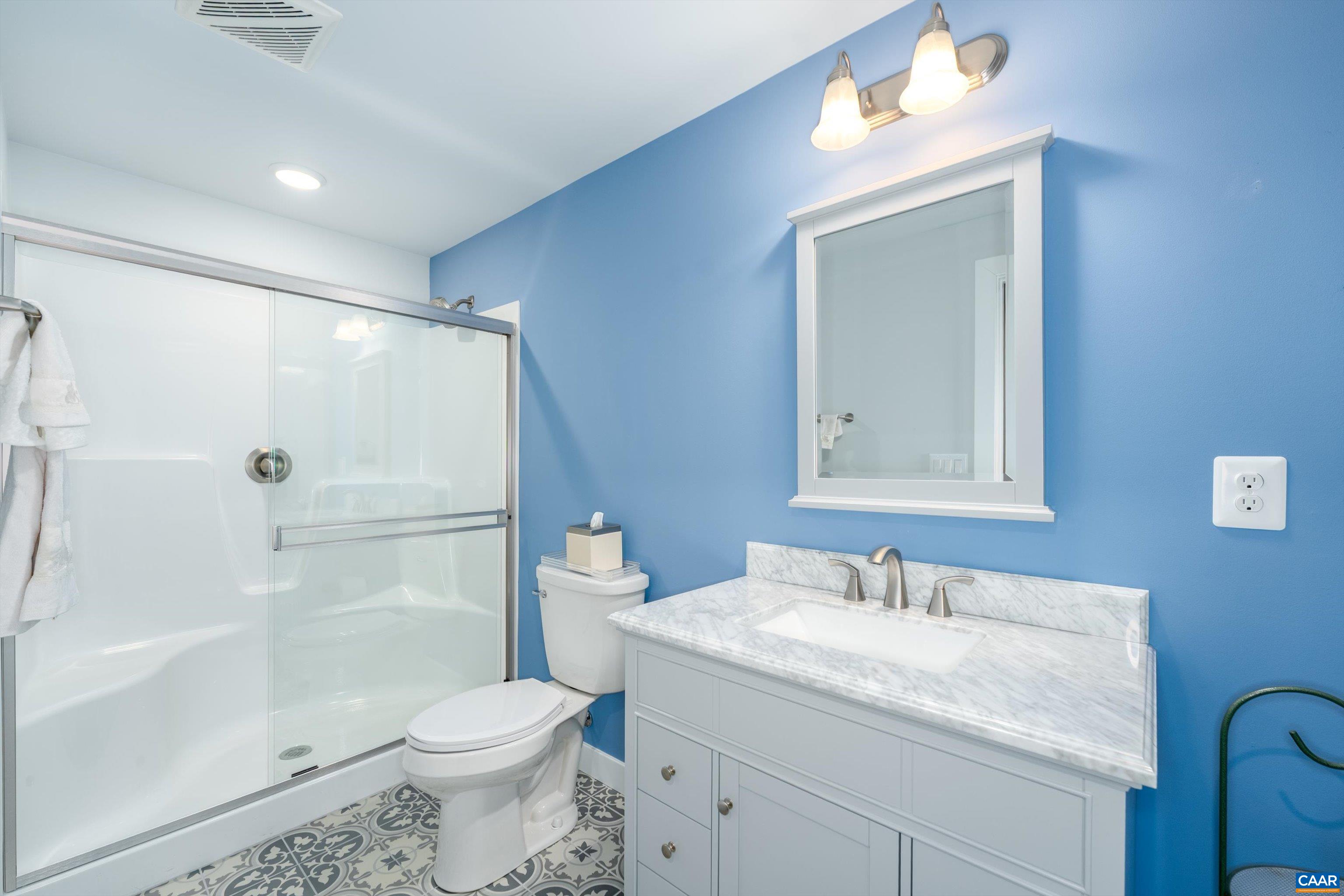 93 Archer Drive Palmyra, VA 22963 - Photo 33 of 45 a bathroom with a granite countertop sink toilet and shower