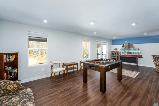 a living room with furniture a table and a window