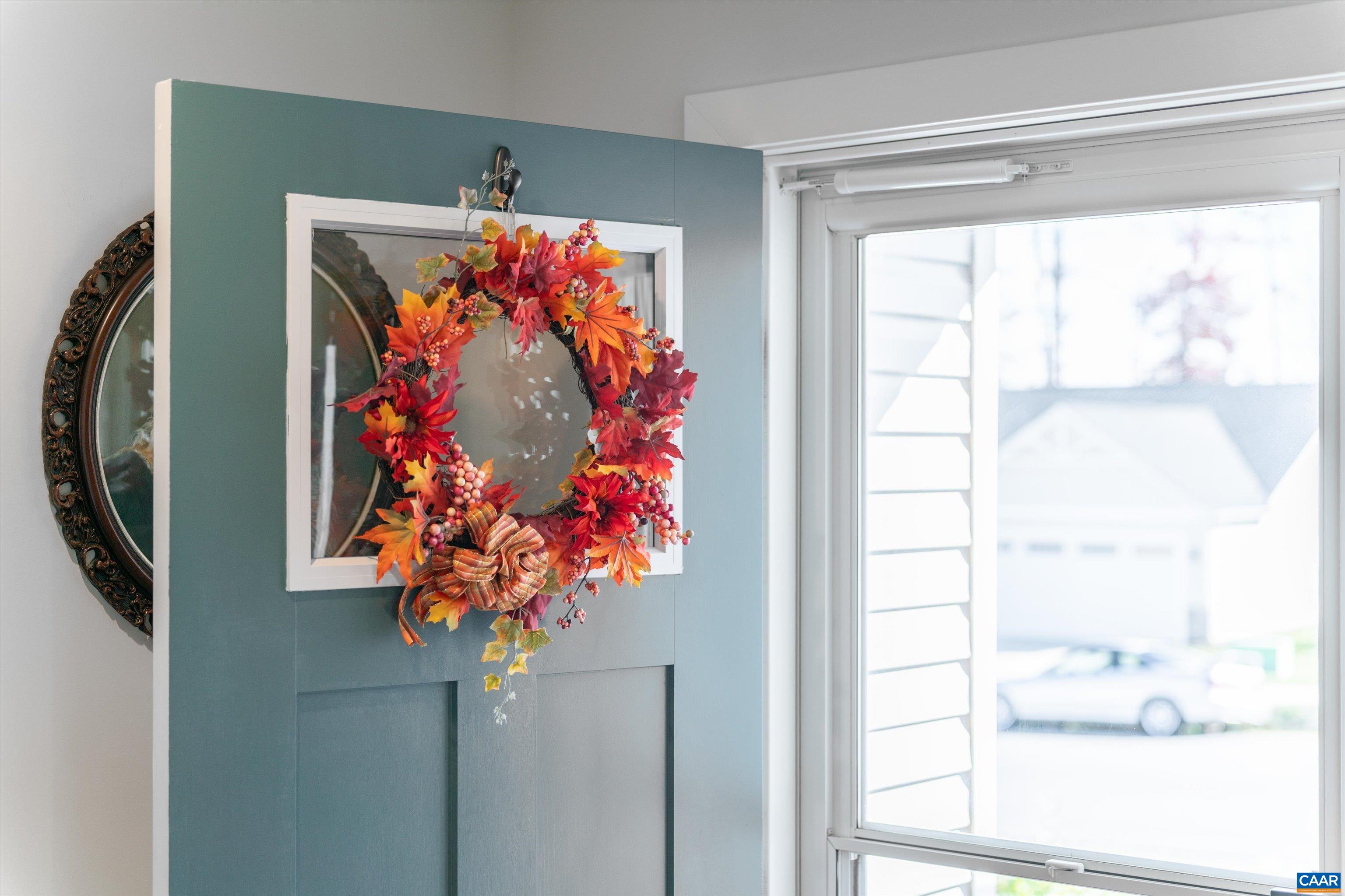 93 Archer Drive Palmyra, VA 22963 - Photo 6 of 45 a vase of flowers sitting on a floor next to a window