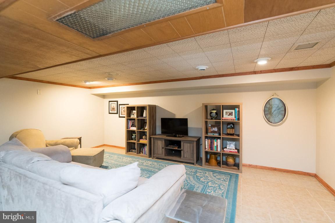 912 Lynvue Road Linthicum Heights, MD 21090 - Photo 24 of 27 Lower Level Family Room with Ceramic Floors