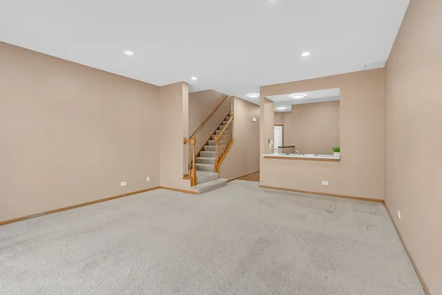 a view of an empty room with a fireplace