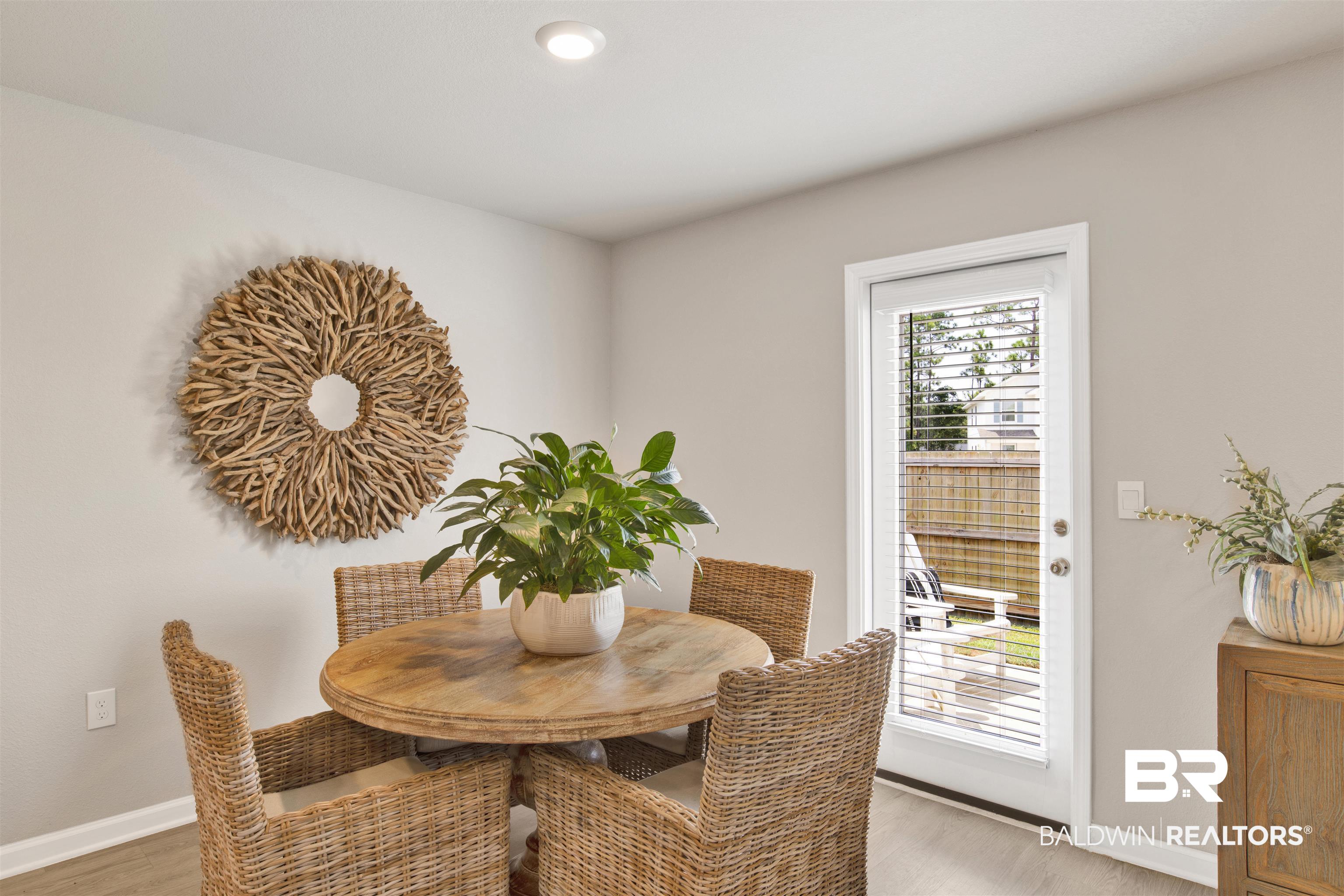 24532 Broken Sound Loop Orange Beach, AL 36561 - Photo 15 of 29 Dining area featuring hardwood / wood-style floors