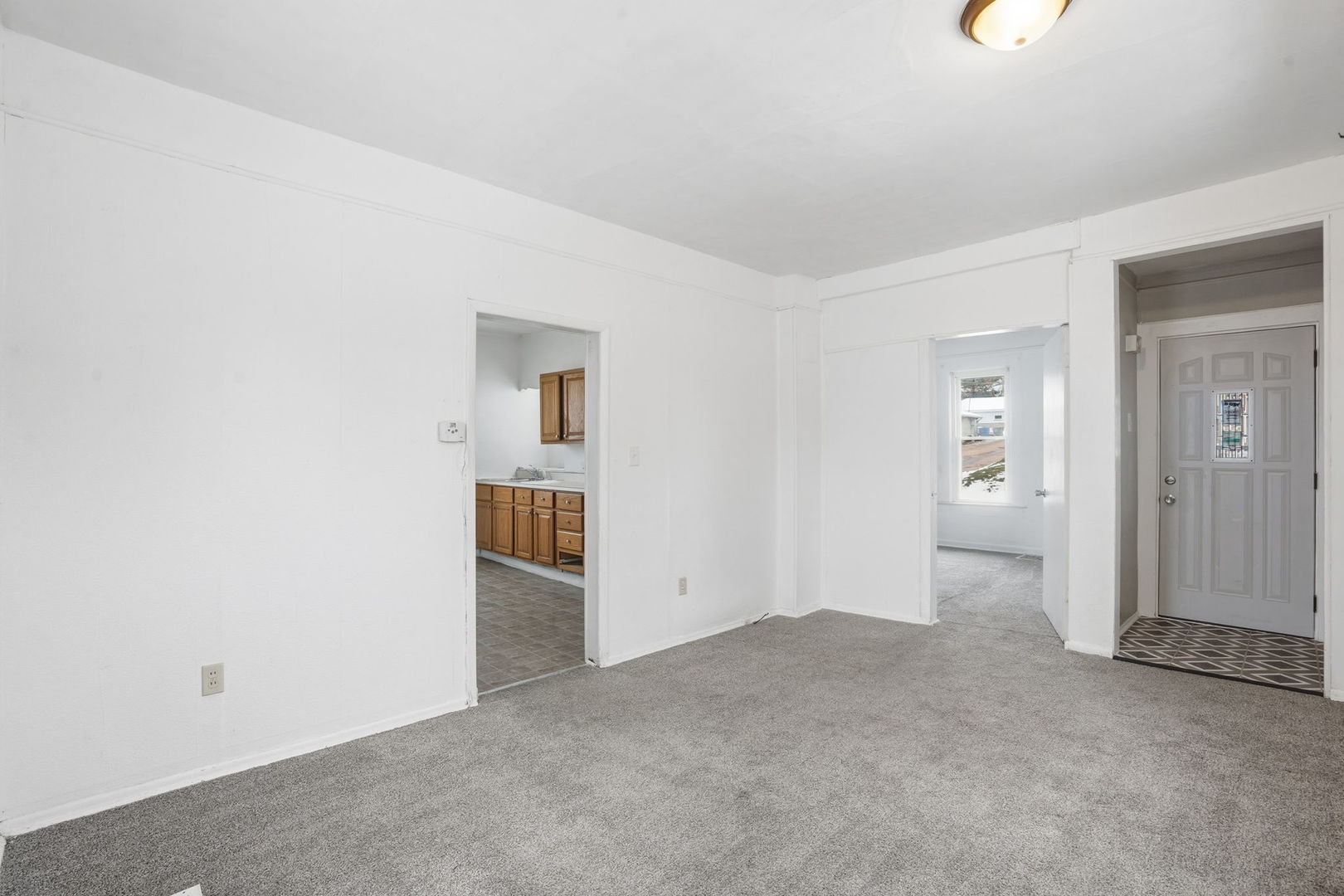 1306 17th Street Moline, IL 61265 - Photo 6 of 14 an empty room with an entrance to other room