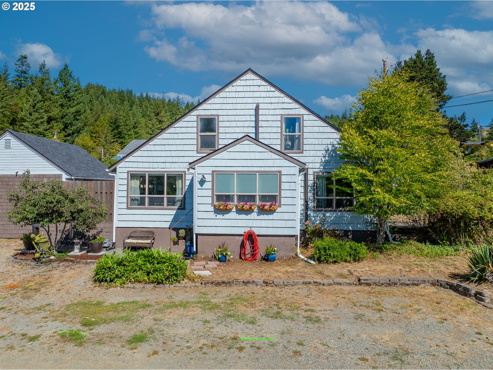 1753 20th Street Myrtle Point, OR 97458 - Photo 1 of 44 a front view of a house with a yard
