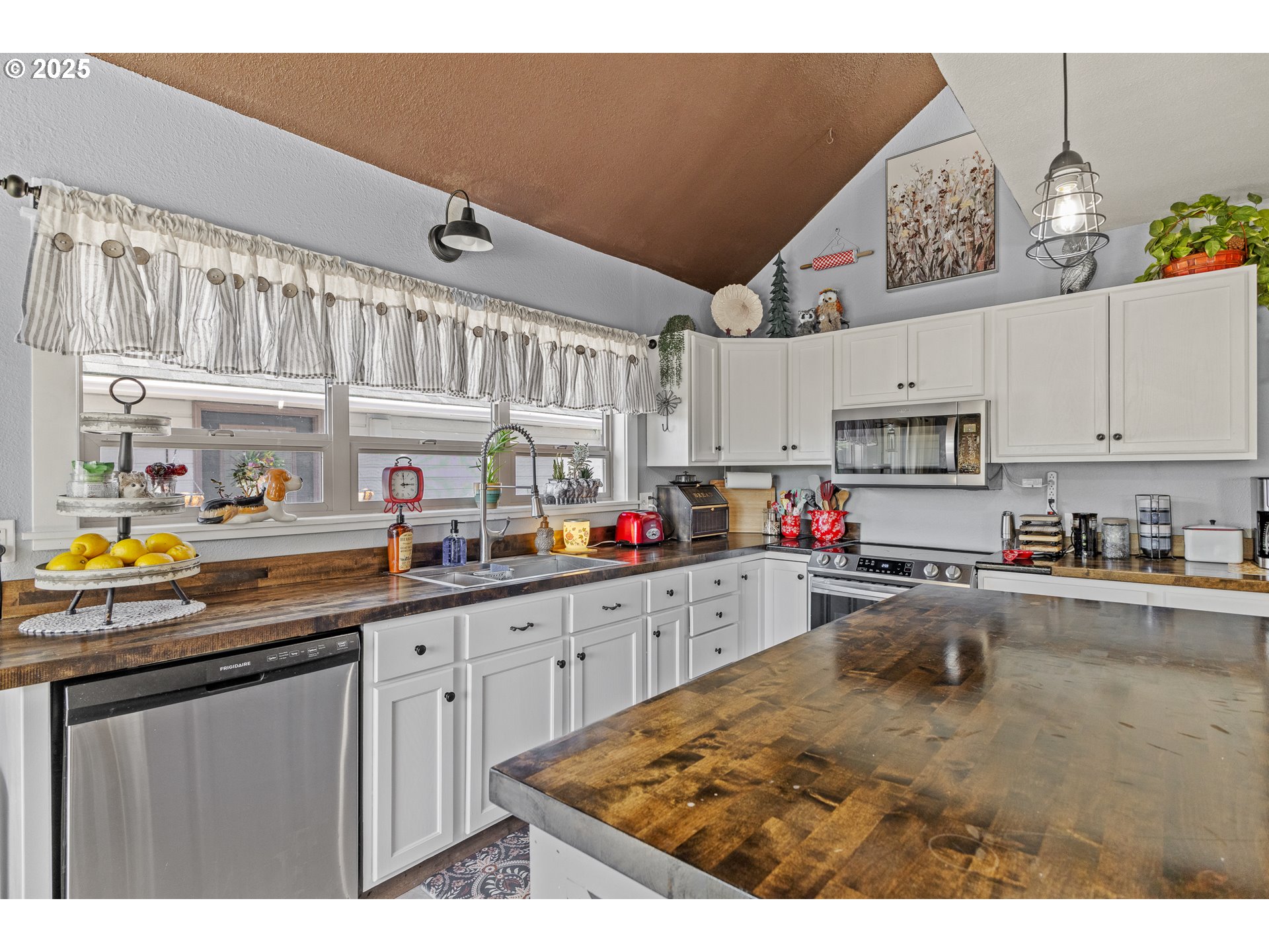 1753 20th Street Myrtle Point, OR 97458 - Photo 12 of 44 a kitchen with kitchen island granite countertop a sink stove and cabinets