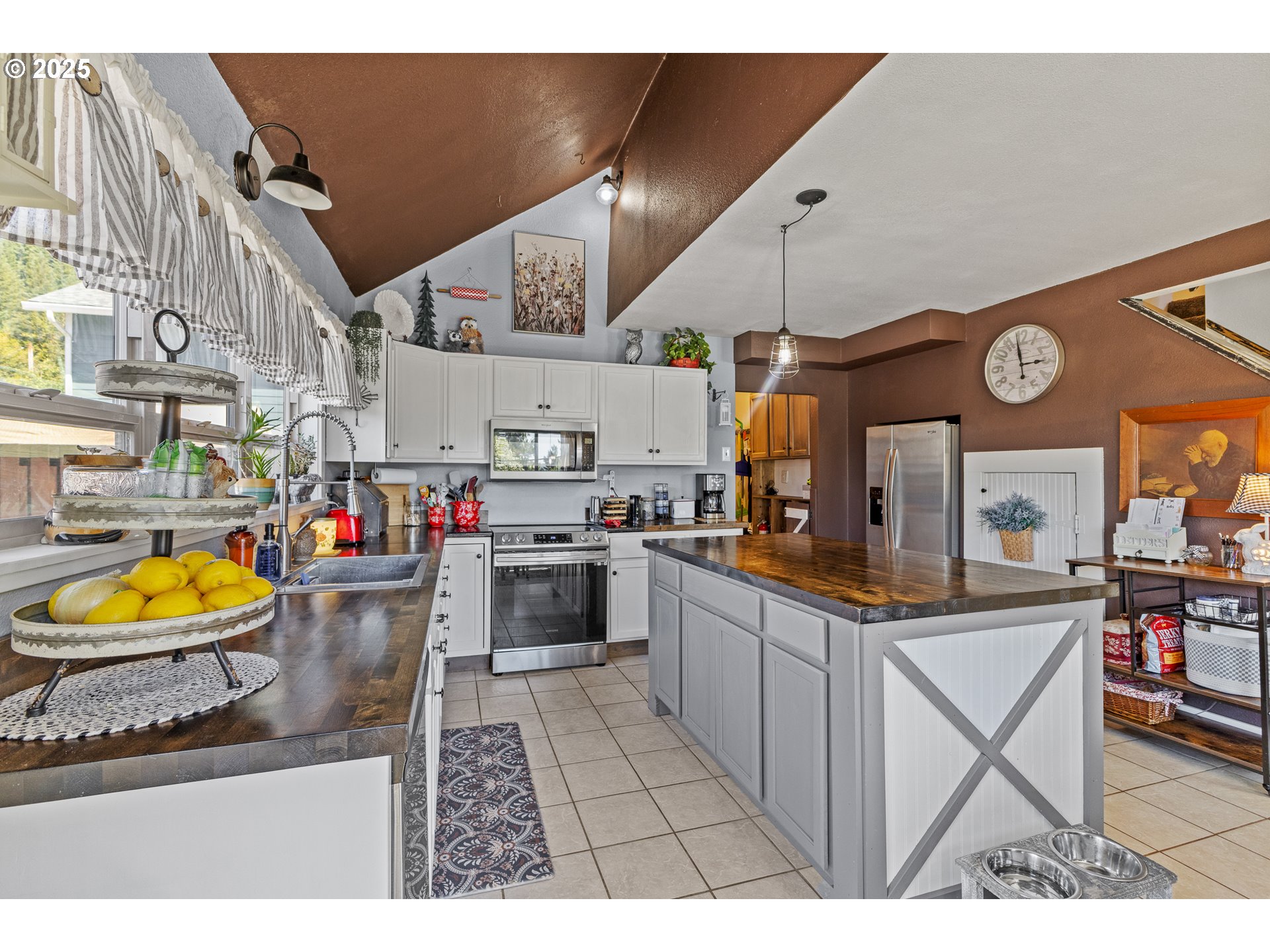 1753 20th Street Myrtle Point, OR 97458 - Photo 14 of 44 a kitchen with stainless steel appliances granite countertop a stove and cabinets