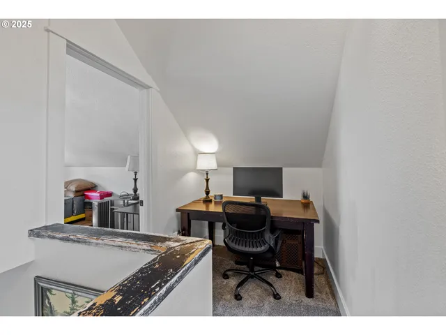 a view of a workspace with furniture