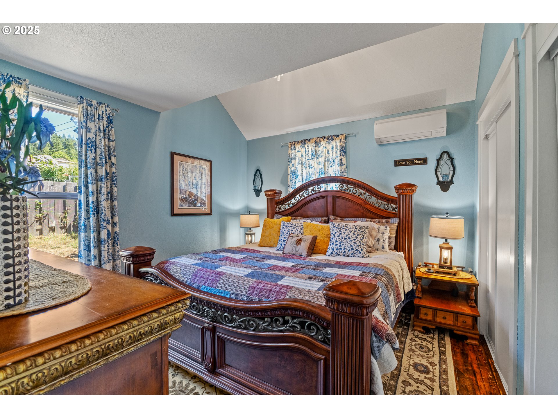 1753 20th Street Myrtle Point, OR 97458 - Photo 19 of 44 a bedroom with a bed and a dresser next to a window