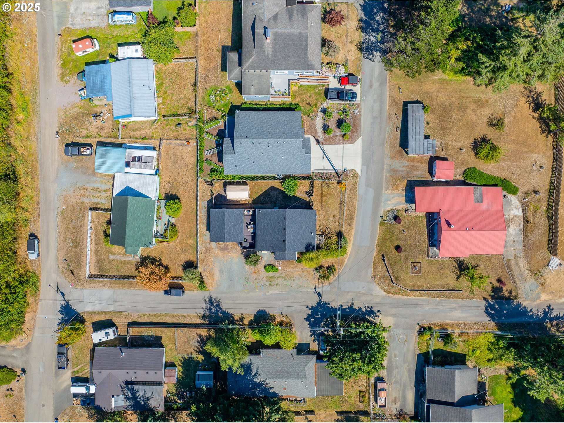 1753 20th Street Myrtle Point, OR 97458 - Photo 38 of 44 an aerial view of residential houses with outdoor space and parking