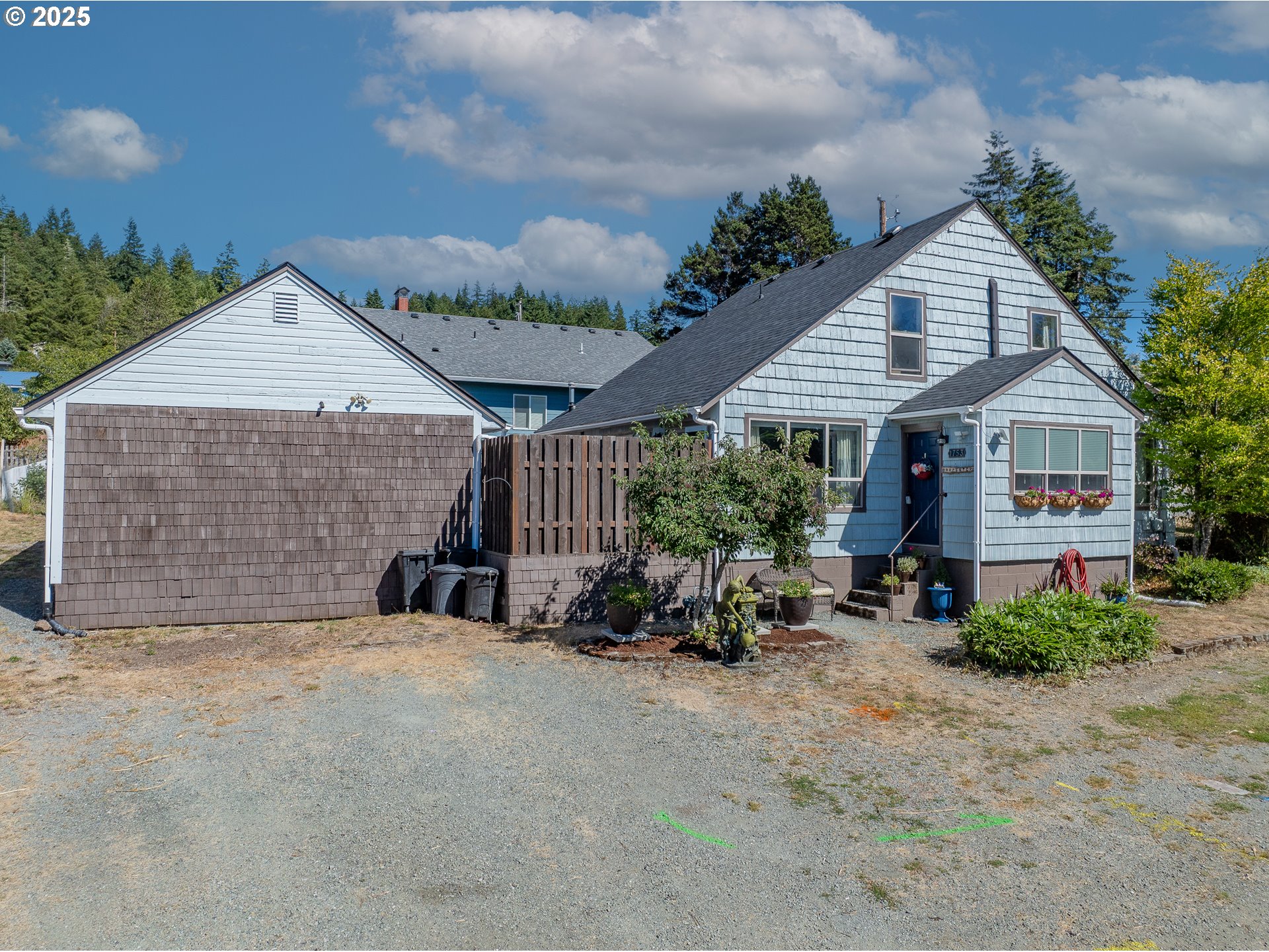 1753 20th Street Myrtle Point, OR 97458 - Photo 44 of 44 a view of a house with backyard and sitting area