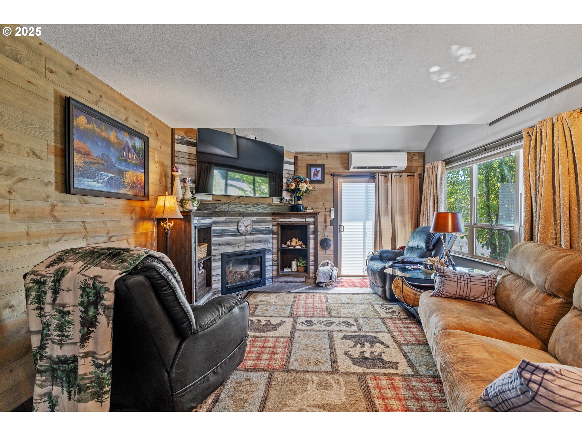 1753 20th Street Myrtle Point, OR 97458 - Photo 7 of 44 a living room with furniture a large window and a fireplace