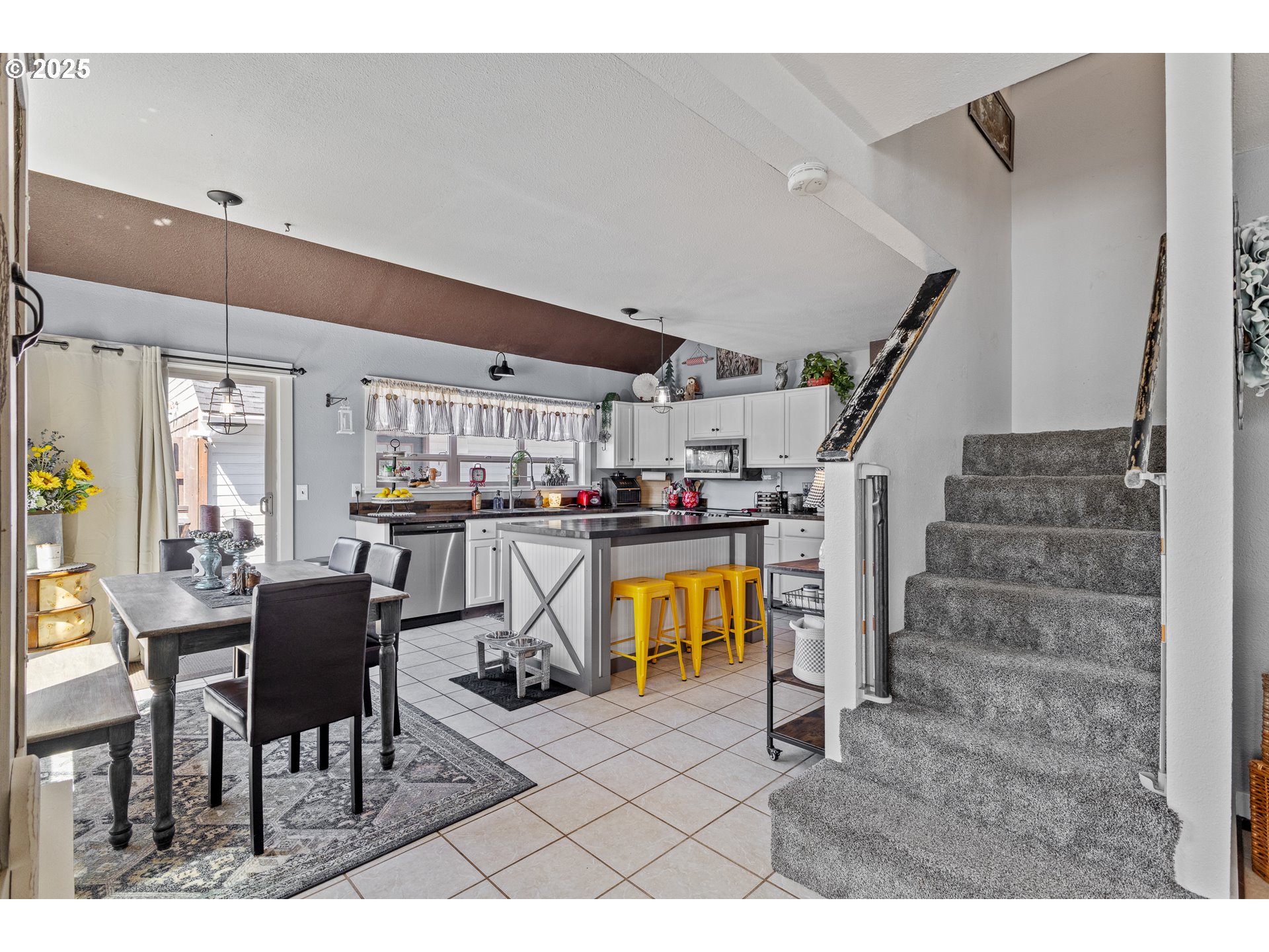 1753 20th Street Myrtle Point, OR 97458 - Photo 10 of 44 a living room with couches and kitchen view with wooden floor