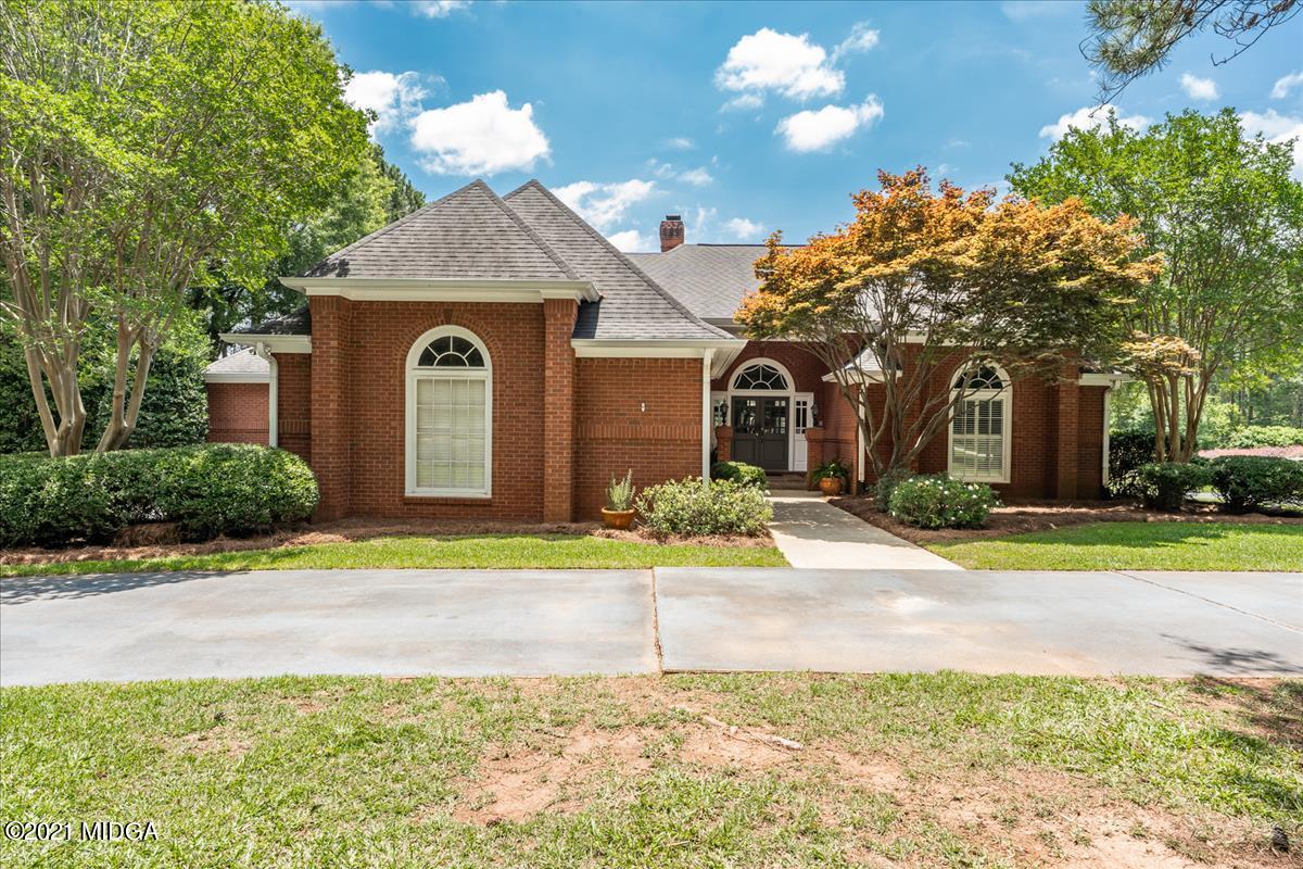 135 Rivoli Ridge Drive Macon, GA 31210 - Photo 1 of 46 a front view of a house with garden