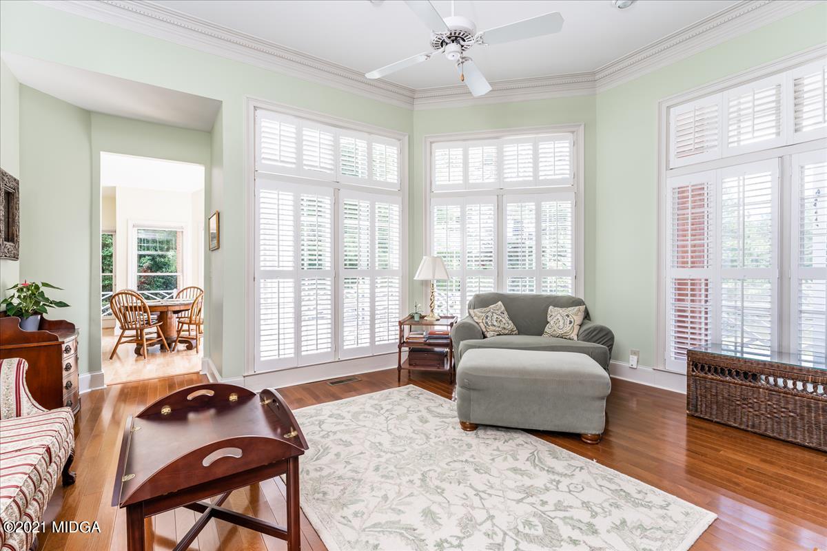135 Rivoli Ridge Drive Macon, GA 31210 - Photo 16 of 46 a bedroom with a bed and wooden floor