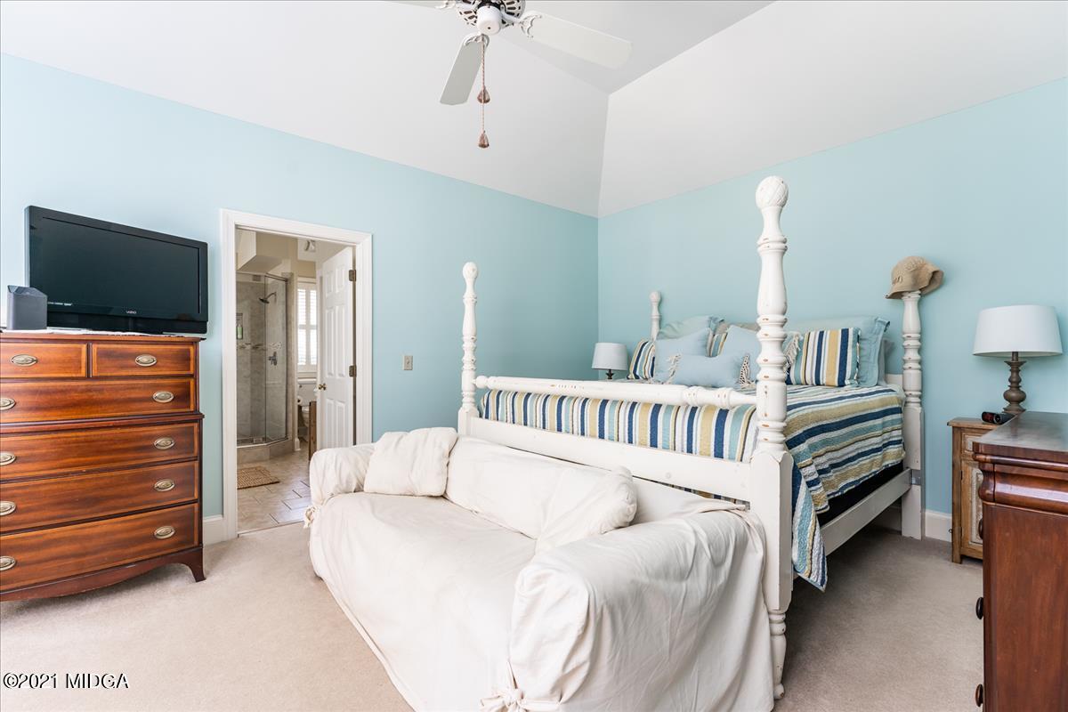 135 Rivoli Ridge Drive Macon, GA 31210 - Photo 17 of 46 a bedroom with furniture and a flat screen tv