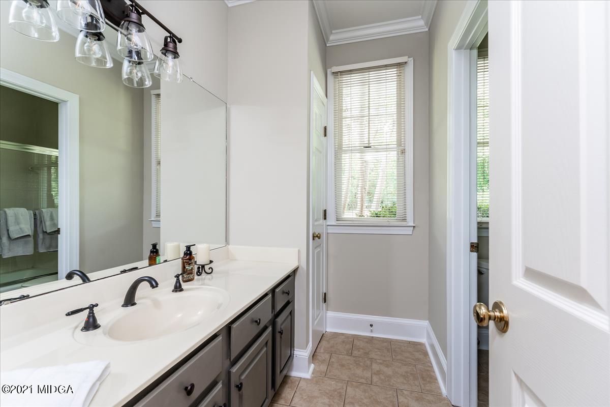 135 Rivoli Ridge Drive Macon, GA 31210 - Photo 24 of 46 a bathroom with a double vanity sink and mirror