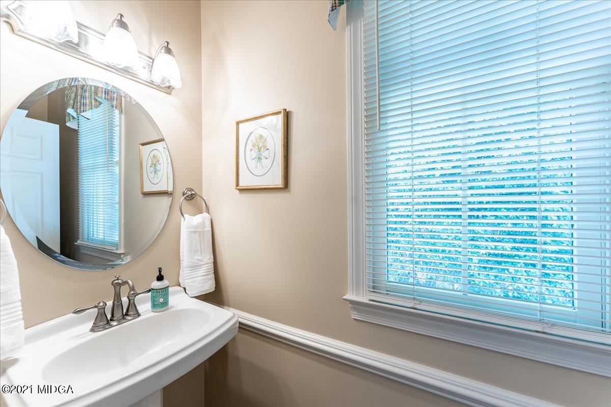 135 Rivoli Ridge Drive Macon, GA 31210 - Photo 26 of 46 a bathroom with a sink and a mirror