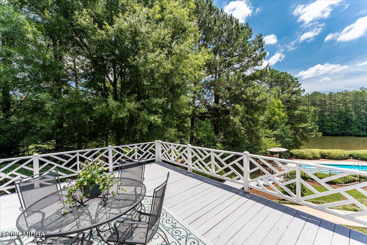 135 Rivoli Ridge Drive Macon, GA 31210 - Photo 30 of 46 a view of a roof deck with couches and wooden floor