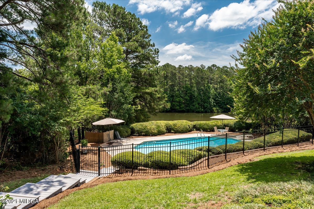 135 Rivoli Ridge Drive Macon, GA 31210 - Photo 31 of 46 a view of a backyard with swimming pool