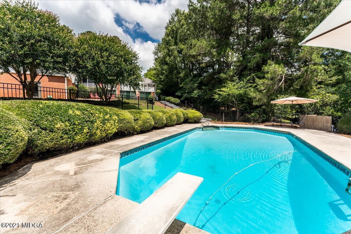 135 Rivoli Ridge Drive Macon, GA 31210 - Photo 32 of 46 a view of a swimming pool with a patio