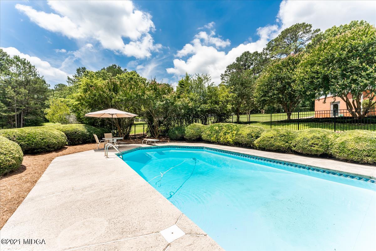 135 Rivoli Ridge Drive Macon, GA 31210 - Photo 34 of 46 a view of a swimming pool and a yard
