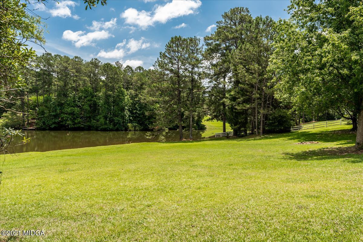 135 Rivoli Ridge Drive Macon, GA 31210 - Photo 36 of 46 a view of swimming pool with an outdoor space and seating area