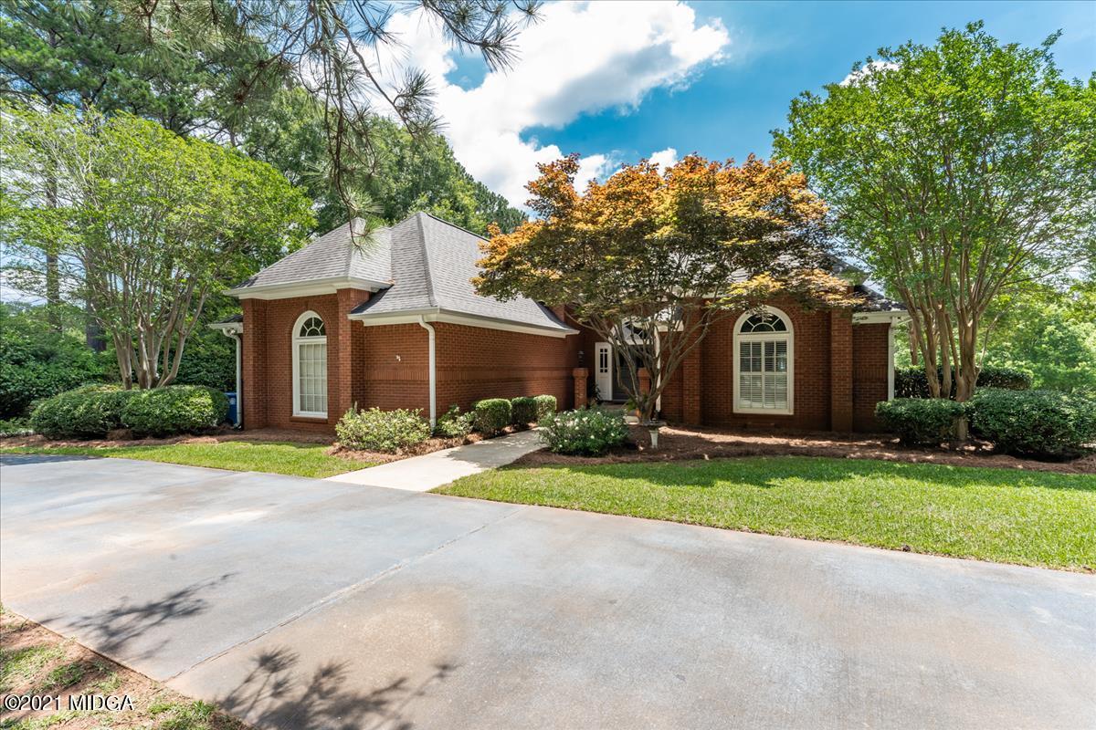 135 Rivoli Ridge Drive Macon, GA 31210 - Photo 41 of 46 a front view of a house with a yard and garage