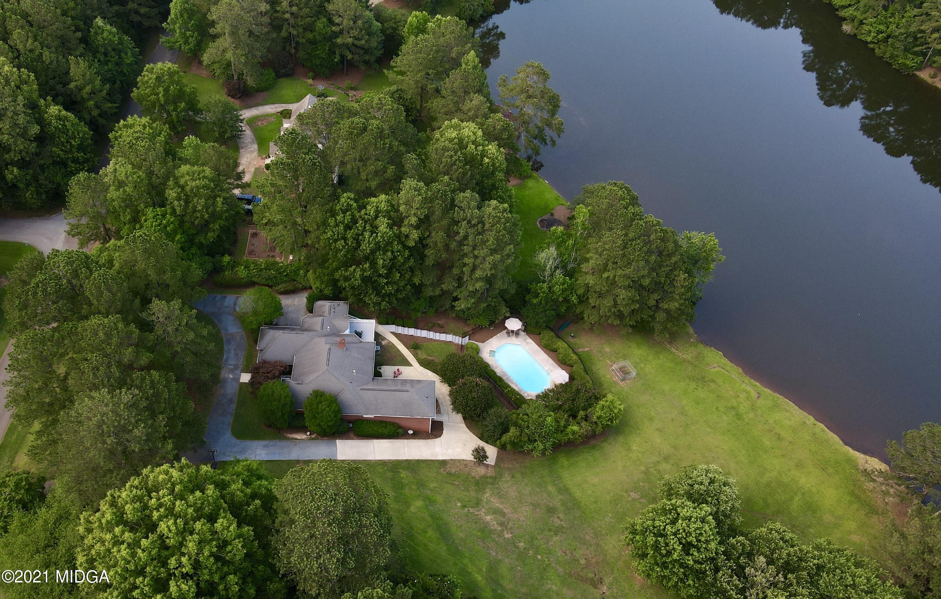 135 Rivoli Ridge Drive Macon, GA 31210 - Photo 45 of 46 an aerial view of a house with swimming pool and garden