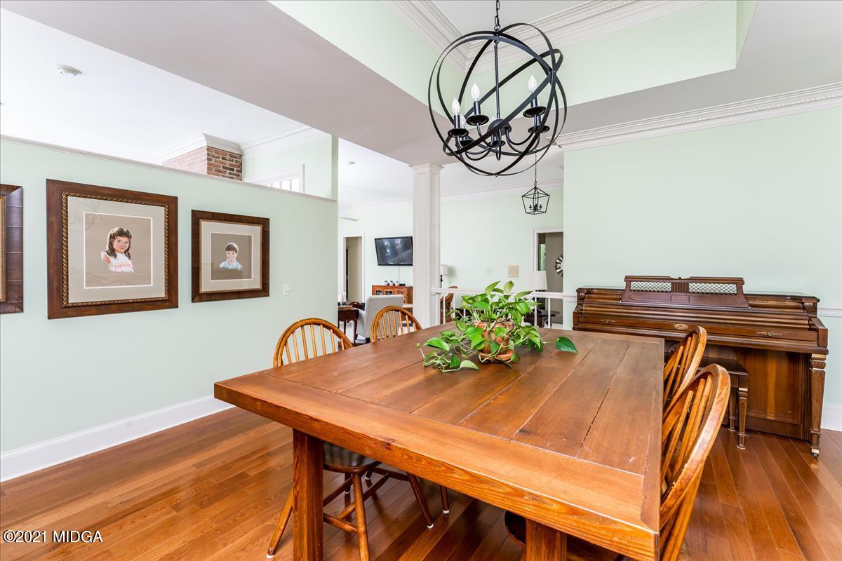 135 Rivoli Ridge Drive Macon, GA 31210 - Photo 9 of 46 a view of a dining room with furniture and wooden floor