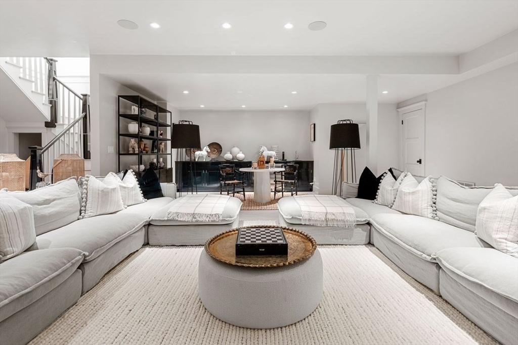 34 Brewster Road Nantucket, MA 02554 - Photo 23 of 40 a living room with furniture a ceiling fan and a rug