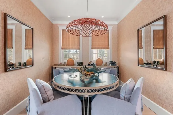 a dining room with furniture and window