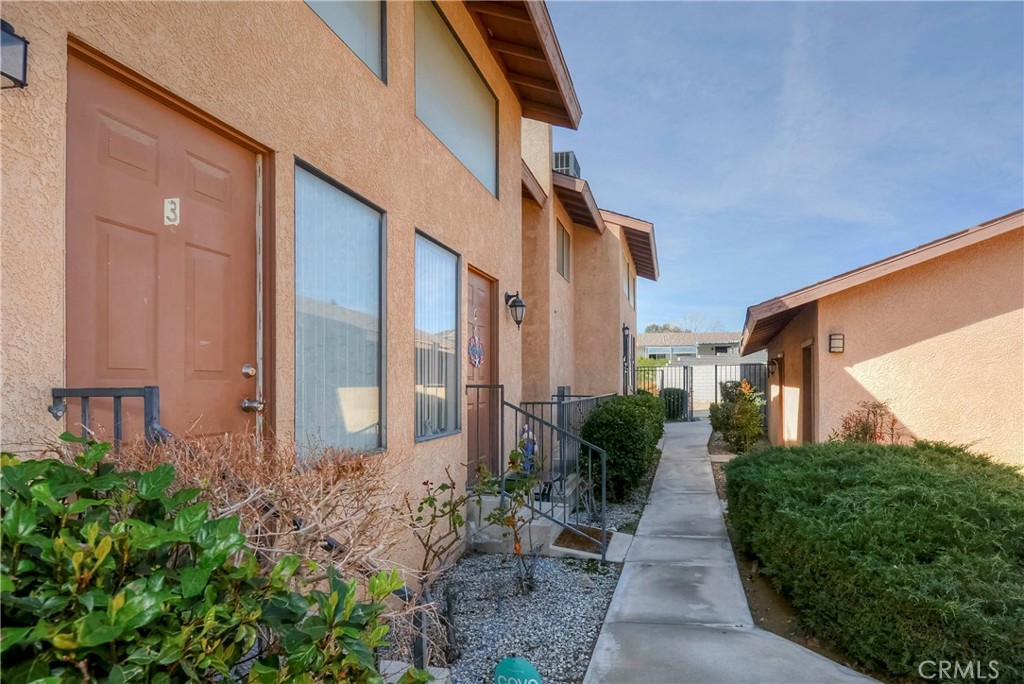 16462 Kalo Road Apple Valley, CA 92307 - Photo 14 of 22 a view of a building with a yard