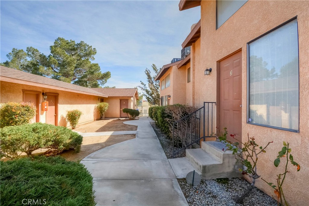16462 Kalo Road Apple Valley, CA 92307 - Photo 15 of 22 a view of a house with backyard and sitting area