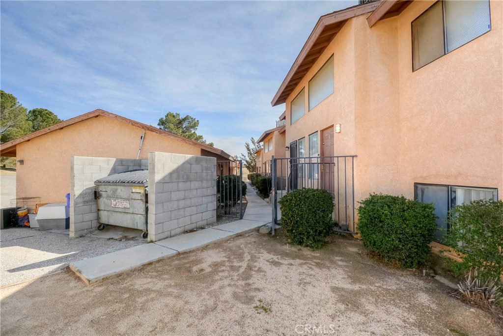 16462 Kalo Road Apple Valley, CA 92307 - Photo 17 of 22 a backyard of a house with barbeque oven and outdoor seating