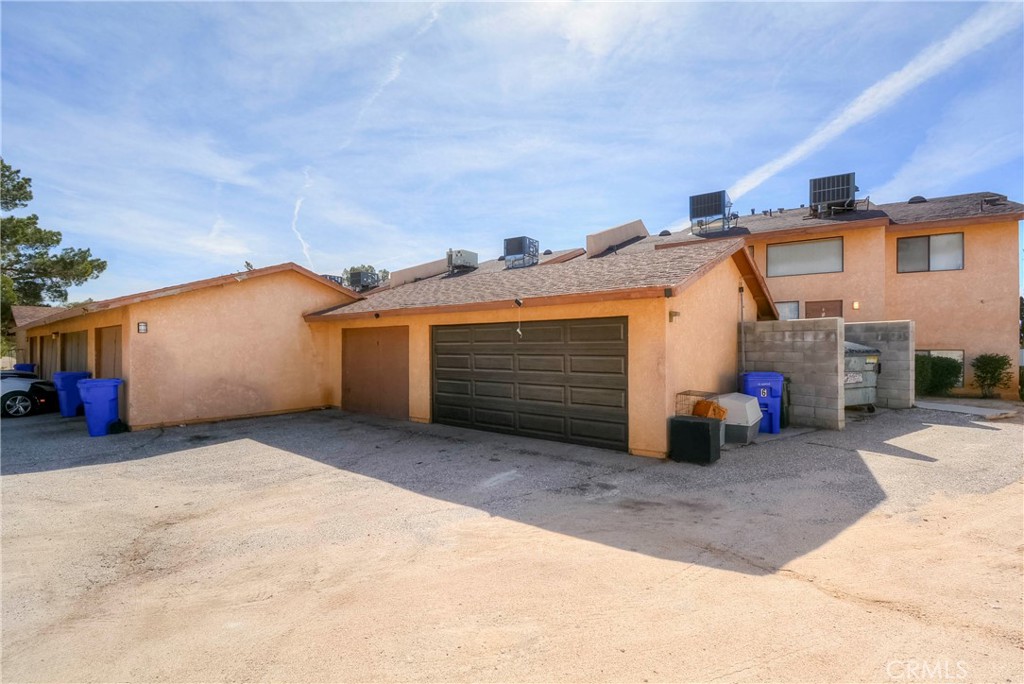 16462 Kalo Road Apple Valley, CA 92307 - Photo 18 of 22 a view of a house with a yard