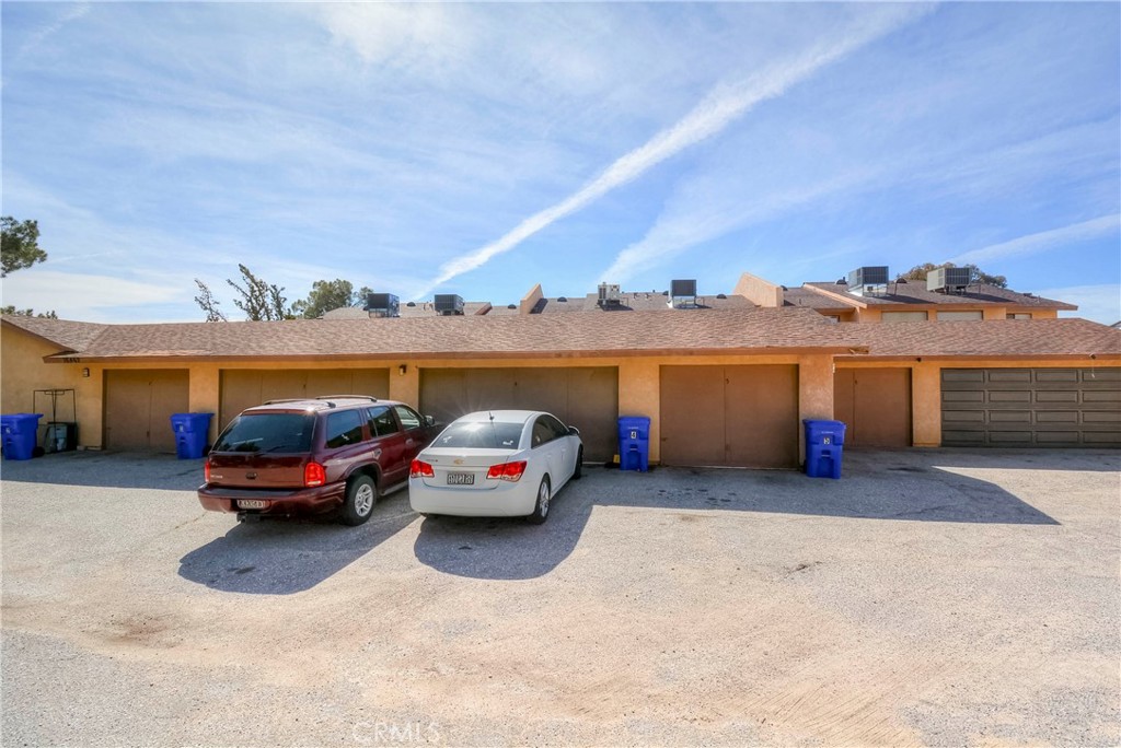 16462 Kalo Road Apple Valley, CA 92307 - Photo 20 of 22 a car parked in front of the house