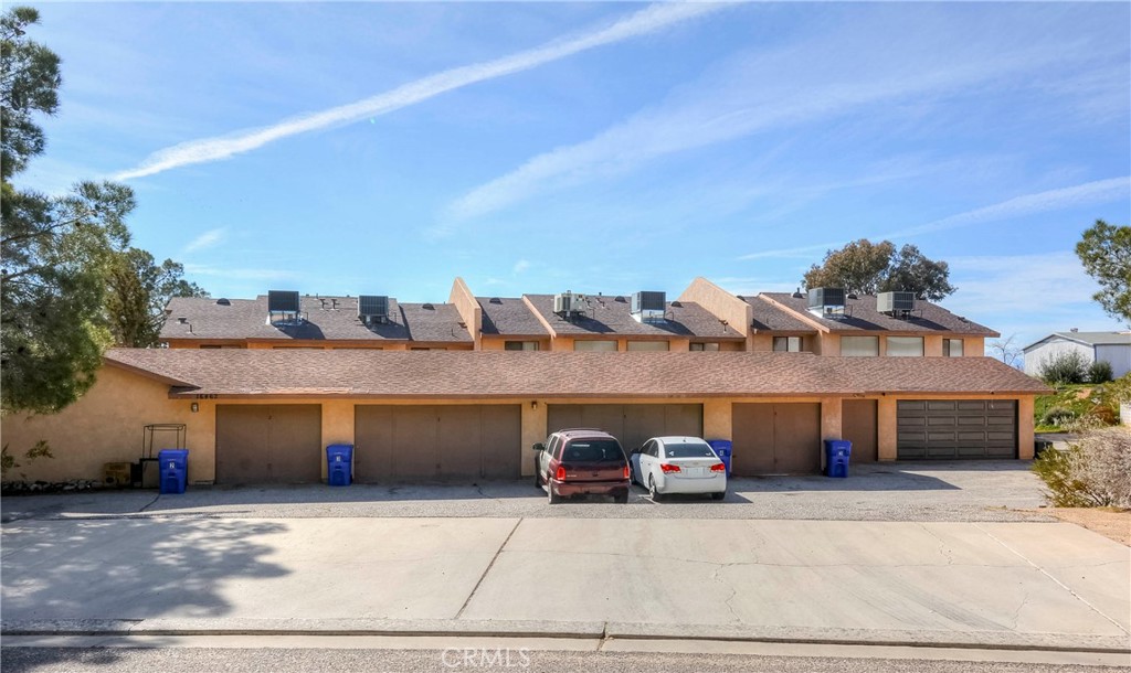 16462 Kalo Road Apple Valley, CA 92307 - Photo 2 of 22 a view of a car parking