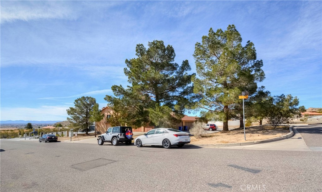 16462 Kalo Road Apple Valley, CA 92307 - Photo 22 of 22 a view of street with parked cars