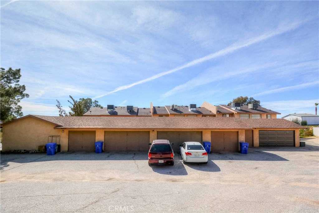 16462 Kalo Road Apple Valley, CA 92307 - Photo 4 of 22 a view of houses with truck parked