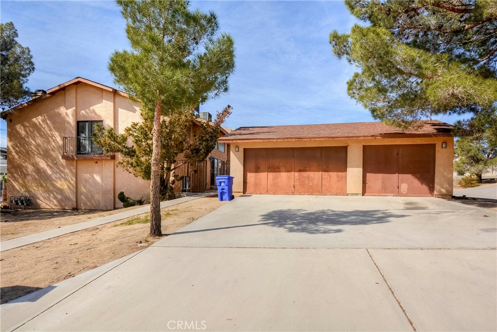 16462 Kalo Road Apple Valley, CA 92307 - Photo 7 of 22 a house with trees in front of it