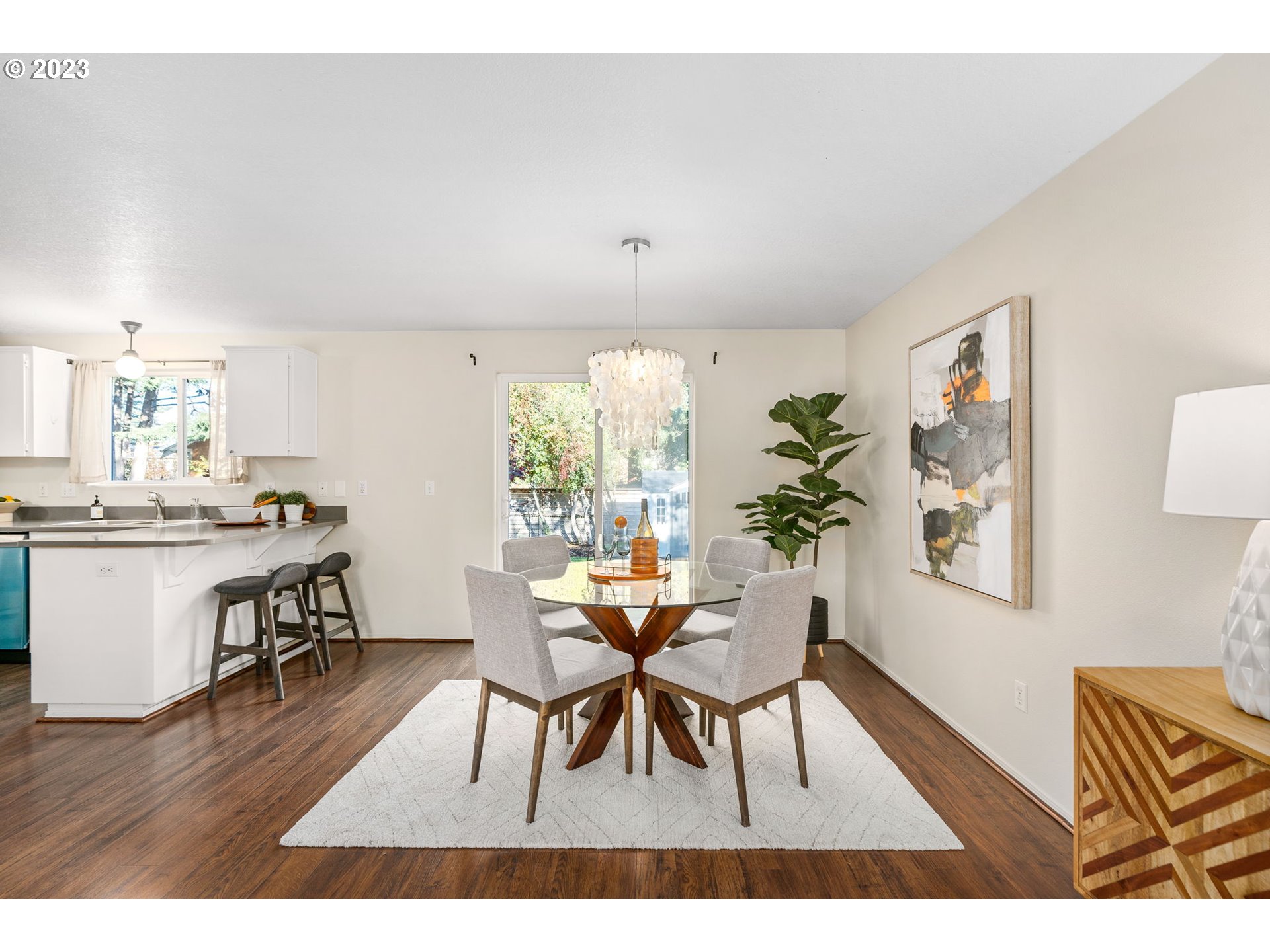 1709 Northeast Rosa Parks Way Portland, OR 97211 - Photo 8 of 23 a view of a dining room with furniture and wooden floor